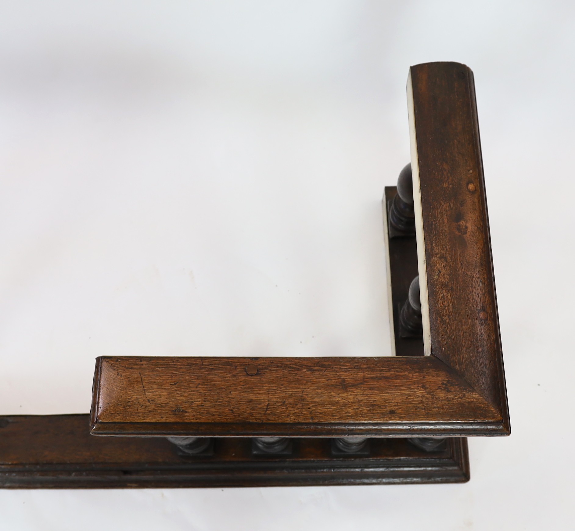 A 19th century brass mounted oak club fender, width 182cm depth 69cm height 58cm